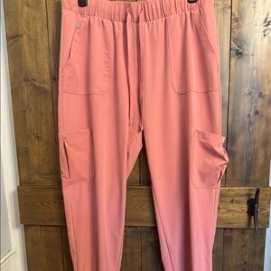 Pink jogger scrub pants.